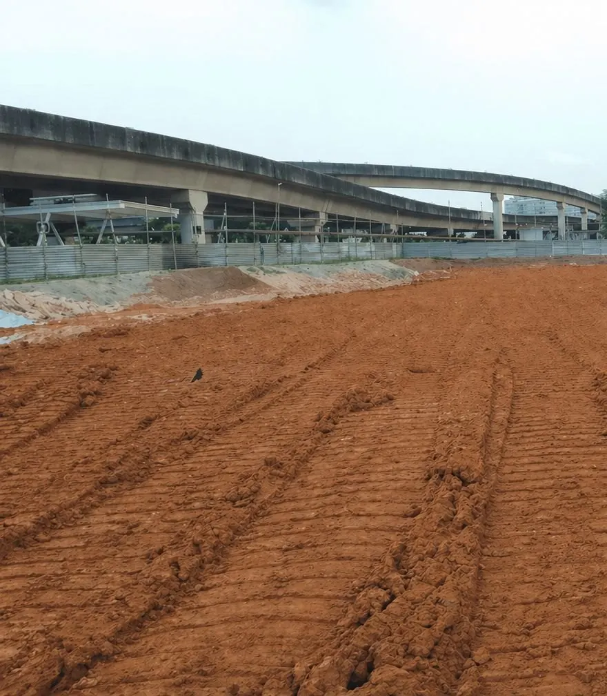 Excavated earth levelled at a construction site